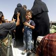 Displaced Syrians who fled from the Islamic State (IS) group's stronghold of Raqa arrive in the village of Hawi al-Hawa