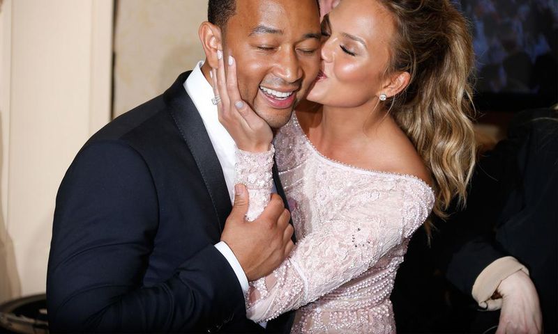 Chrissy Teigen and John Legend are a poster couple for PDA [Credit Getty]