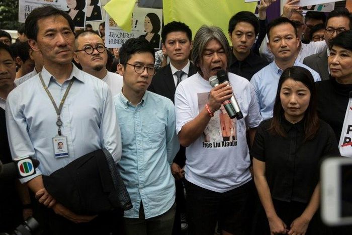 Hong Kong pro-democracy lawmakers Edward Yiu Chung-yim (L), Nathan Law (2nd L), Leung Kwok-hung also known as 'long hair' (C) and Lau Siu-lai (R) have been disqualified from parliament after changing their oaths of office