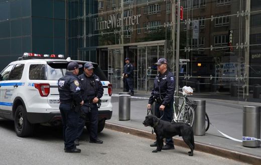 Police stand outside the Time Warner Building on October 24, 2018, after an explosive device was delivered to CNN's New York bureau
