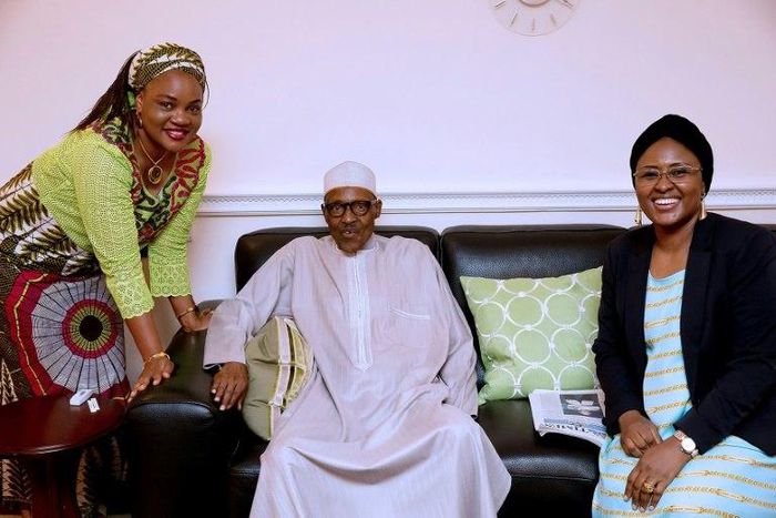 In this handout photograph taken and released by The Nigerian State House on July 26, ailing Nigerian President Muhammadu Buhari (C) poses with his wife Aisha Buhari (R) and the wife of Benue State Governor Eunice Ortom as he received a courtesy visit ...