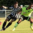 English forward Lewis Grabban (R), then of Bournemouth, is tackled by Angers midfielder Baptiste Santamaria during an international friendly in Saumur, northwestern France on August 6, 2016
