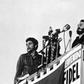 In this picture from 1959, Fidel Castro (center) delivers a speech next to Camilo Cienfuegos (right) and Che Guevara (left)