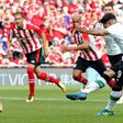 Liverpool's midfielder Roberto Firmino scores from the penalty spot against Athletic Bilbao on August 5, 2017