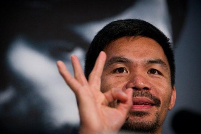 Manny Pacquiao touched down in Brisbane late Saturday from Manila with a large entourage for his World Boxing Organization welterweight title bout at Suncorp Stadium next weekend