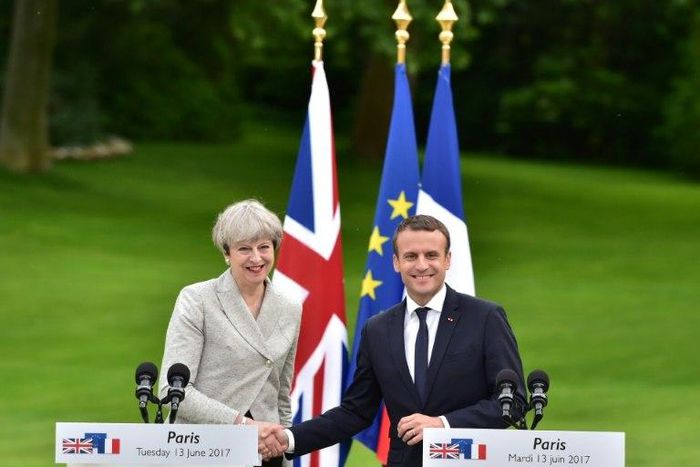 Britain's Prime Minister Theresa May (L) and France's President Emmanuel Macron meet at The Elysee Palace in Paris on June 13, 2017