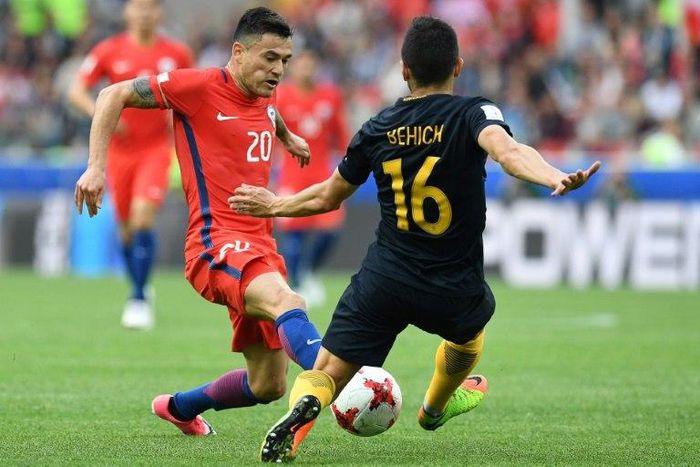 Chile's midfielder Charles Aranguiz (left) vies with Australia's defender Aziz Behich during a 2017 Confederations Cup match at the Spartak Stadium in Moscow on June 25, 2017