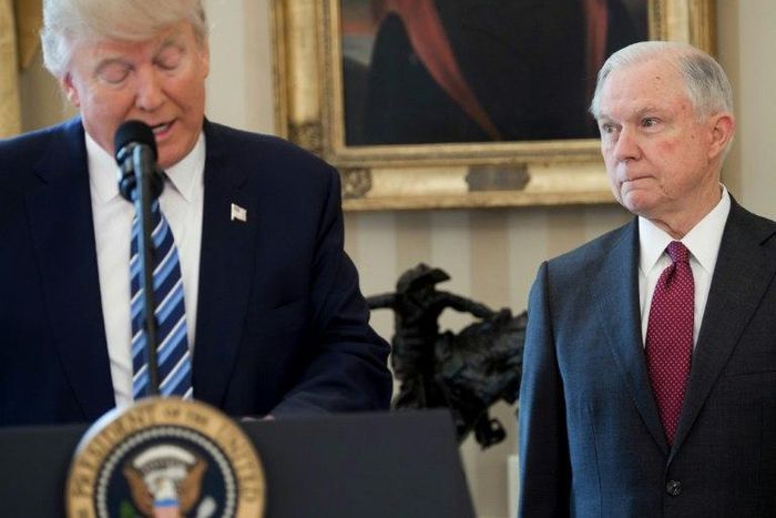 US President Donald Trump speaks alongside US Attorney General Jeff Sessions after Sessions was sworn in as Attorney General, at the Oval Office of the White House in Washington, DC, in February 2017