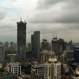 Dark clouds gather over India's financial capital of Mumbai during the monsoon season, when building collapses across the country become more common