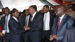President Uhuru Kenyatta greeting Wiper Leader Kalonzo Musyoka as DP William Ruto watches