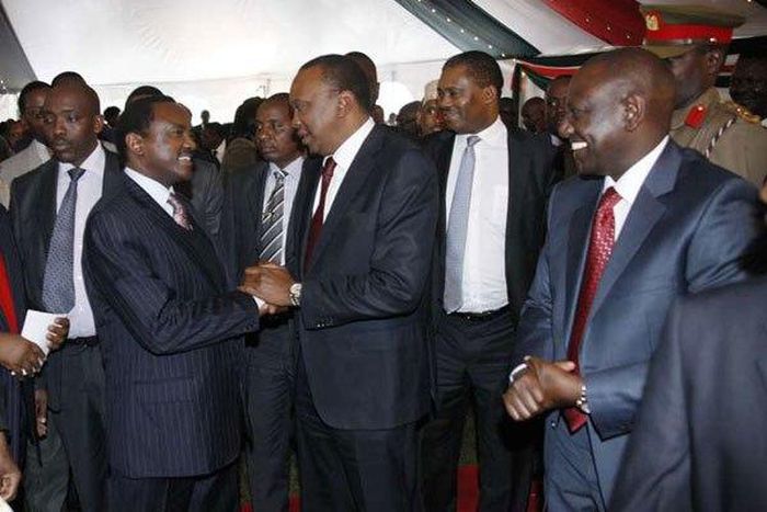 President Uhuru Kenyatta greeting Wiper Leader Kalonzo Musyoka as DP William Ruto watches