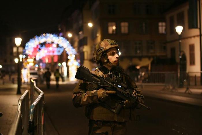 A soldier patrolling near the famed Christmas market in Strasbourg, which has become the latest French city to be hit by a suspected deadly terror attack