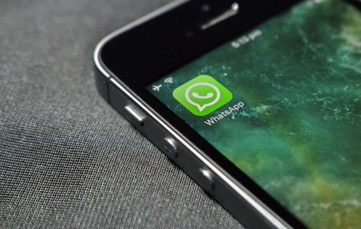 WhatsApp icon on a phone screen