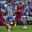 Manchester City's Bernardo Silva (R) runs with the ball during their English Premier League match against Brighton & Hove Albion, at the American Express Community Stadium in Brighton, on August 12, 2017