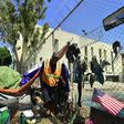 Homeless veteran Kendrick Bailey steps out of his tent on a streetcorner near Skid Row in downtown Los Angeles