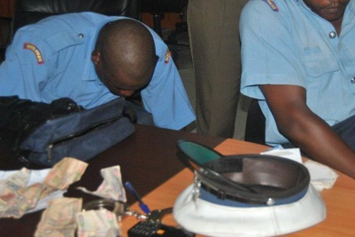 2 police officers who were arrested during a past crackdown