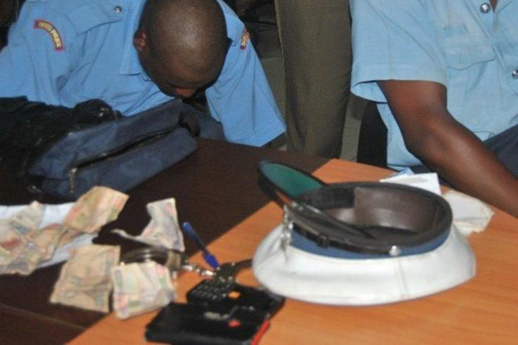 2 police officers who were arrested during a past crackdown
