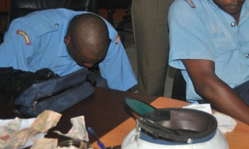 2 police officers who were arrested during a past crackdown