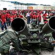 Members of Venezuela's army show civilians how to handle an anti-aircraft battery during military drills