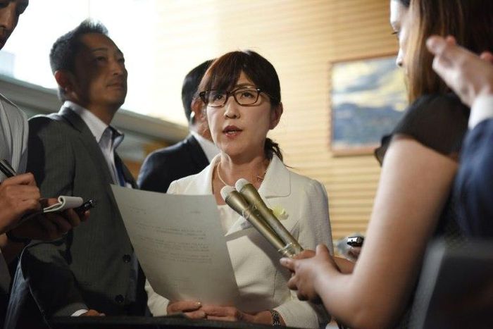Japan's Defence Minister Tomomi Inada (C) will resign over an alleged coverup involving military documents