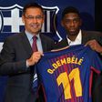 Barcelona's new player Ousmane Dembele (R) poses with his new jersey next to Barcelona's president Josep Maria Bartomeu at the Camp Nou stadium on August 28, 2017