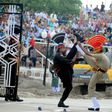 Indian and Pakistani border guards take part in the ceremony at the India-Pakistan border in Wagah