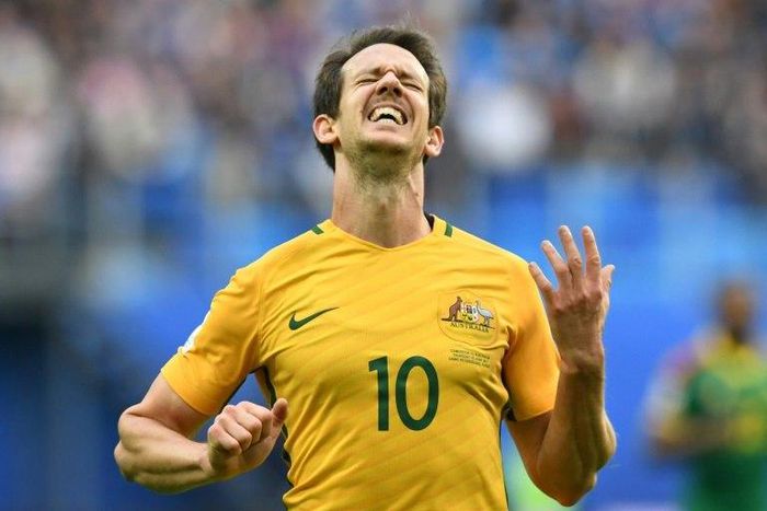 Australia's midfielder Mark Milligan celebrates after scoring with a penalty during the 2017 Confederations Cup group B football match against Cameroon June 22, 2017