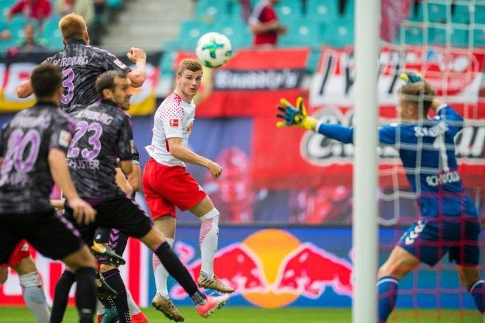 Leipzig's Timo Werner (C) scores the first goal for his team during their match against SC Freiburg in Leipzig, eastern Germany on August 27