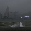 Hong Kong's skyline seen across Victoria harbour had a dark, foreboding air as Severe Typhoon Hato smashed through the city
