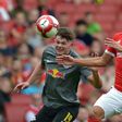 Leipzig's Scottish midfielder Oliver Burke (left) vies with Benfica's Argentinian defender Lisandro Lopez during their pre-season friendly match at The Emirates Stadium in north London on July 30, 2017