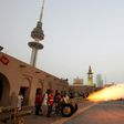 A picture taken on June 24, 2017 shows a cannon being shot at the Nayef Palace in Kuwait City signalling the end of the holy fasting month of Ramadan
