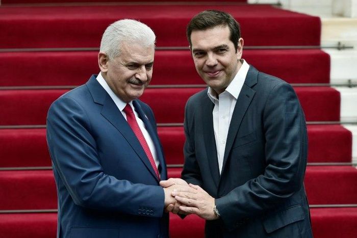 Greek Prime Minister Alexis Tsipras (left) and his Turkish counterpart Binali Yildirim struck a positive note after their talks in Athens Monday