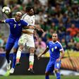 Curacao's midfielder Leandro Bacuna (L) and Mexico's defender Jair Pereira (C) jump for the ball as Curacao's forward Gino van Kessel watches (R) during the second half of their CONCACAF Gold Cup match at the Alamodome in San Antonio, Texas