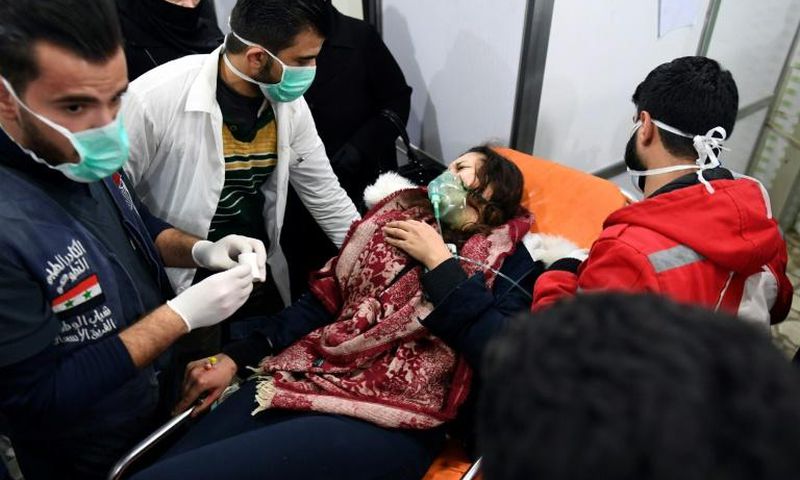 A Syrian woman receives treatment at a hospital after an assault on Aleppo, which Russia claimed was a chemical attack by rebels