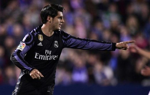 Real Madrid's forward Alvaro Morata celebrates after scoring their third goal during the Spanish league football match Club Deportivo Leganes SAD vs Real Madrid CF at the Estadio Municipal Butarque in Leganes on April 5, 2017