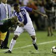 Florent Malouda (L) of French Guiana fights for the ball with Ever Alvarado of Honduras, at BBVA Compass Stadium in Houston, Texas, on July 11, 2017