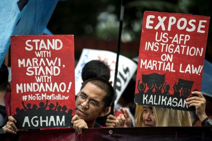 Activists protested against martial law while the debate was happening