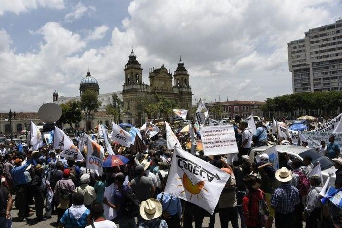 Members of the Peasant Development Committee take part in a demonstration demanding Guatemalan President Jimmy Morales' resignation in Guatemala City on August 28, 2017