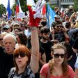 Poles rally in Warsaw to protest against court reforms they see as undermining the separation of powers