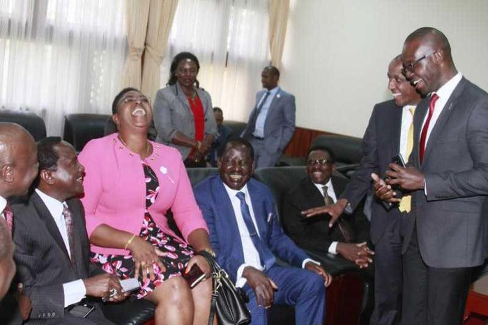MP Aisha Jumwa shares a light moment with a section of Opposition MPs