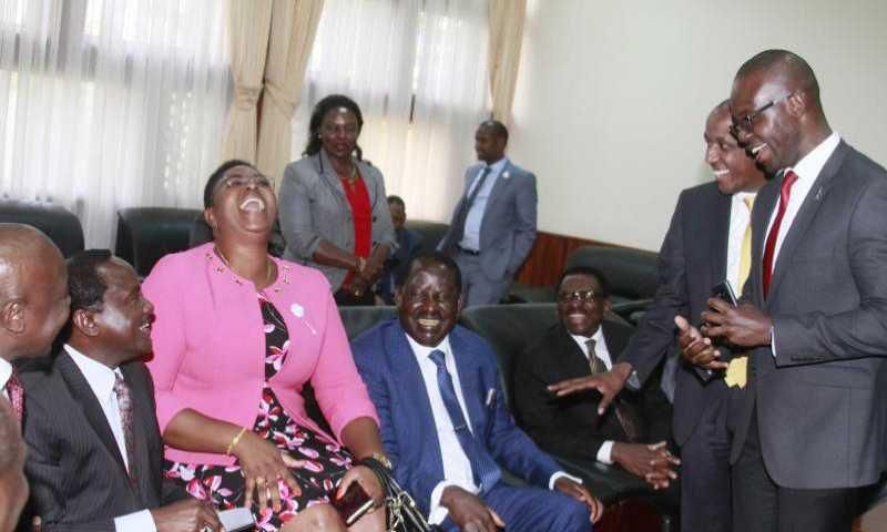 MP Aisha Jumwa shares a light moment with a section of Opposition MPs