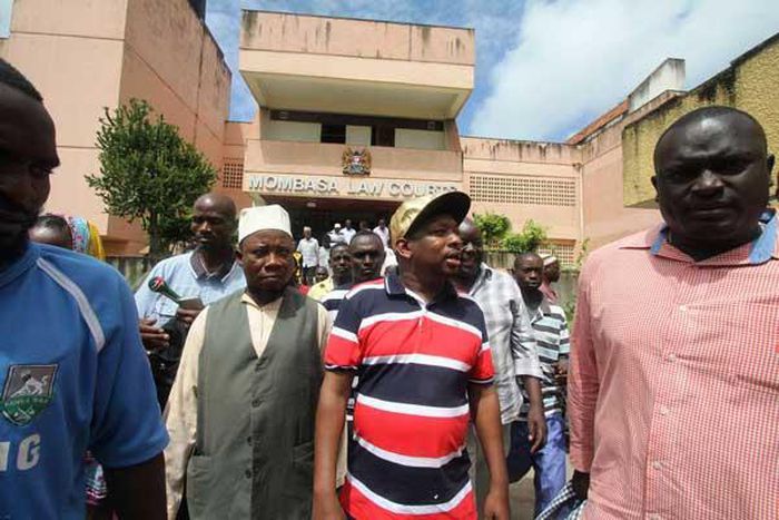 Nairobi Senator Mike Mbuvi Sonko (second right) leaves the Mombasa Law Courts on June 12, 2017 after he was discharged from being surety for the fugitive Mombasa Republican Council leader Omar Mwamnuadzi.