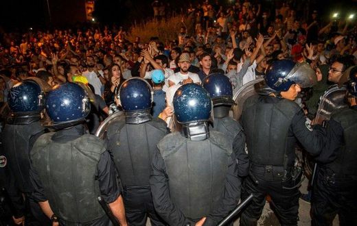 Protesters face security forces during a demonstration against corruption and employment in the northern Rif region, June 8, 2017 in Al Hoceima, Morocco