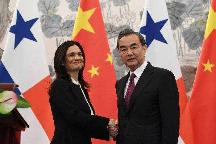 Panama's Vice President and Foreign Minister Isabel Saint Malo shakes hands with Chinese Foreign Minister Wang Yi after the two signed a joint communique agreeing to establish diplomatic relations, in Beijing, on June 13, 2017