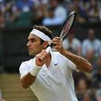 Switzerland's Roger Federer returns against Germany's Mischa Zverev at Wimbledon on July 8, 2017