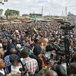 Kenya's opposition leader Raila Odinga (L) speaks in the Kibera district of Nairobi on August 13, 2017