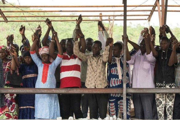 Relatives and friends pay homage to victims of the June 18 terrorist attack at the Campement Kangaba resort, close to Bamako.