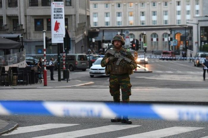 A soldier stands alert in a cordoned off area outside Gare Central in Brussels on June 20, 2017, after an explosion
