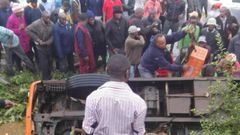 The matatu in the ditch with passengers stuck inside