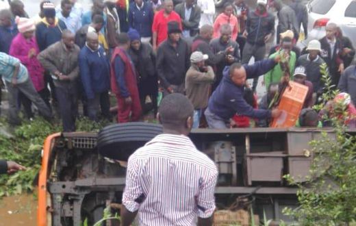 The matatu in the ditch with passengers stuck inside